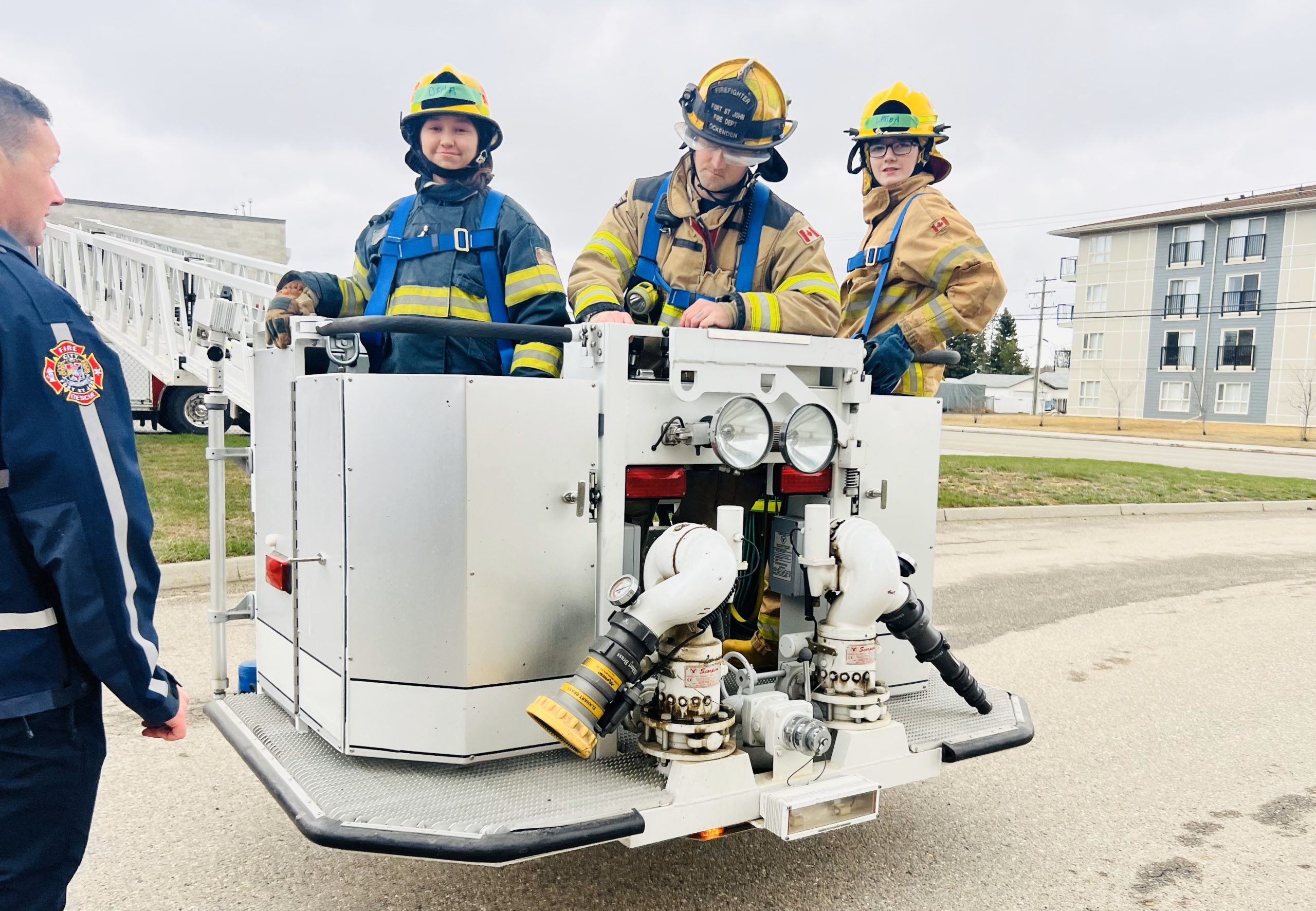 Fire Boot Camp students learning from professional firefighters.