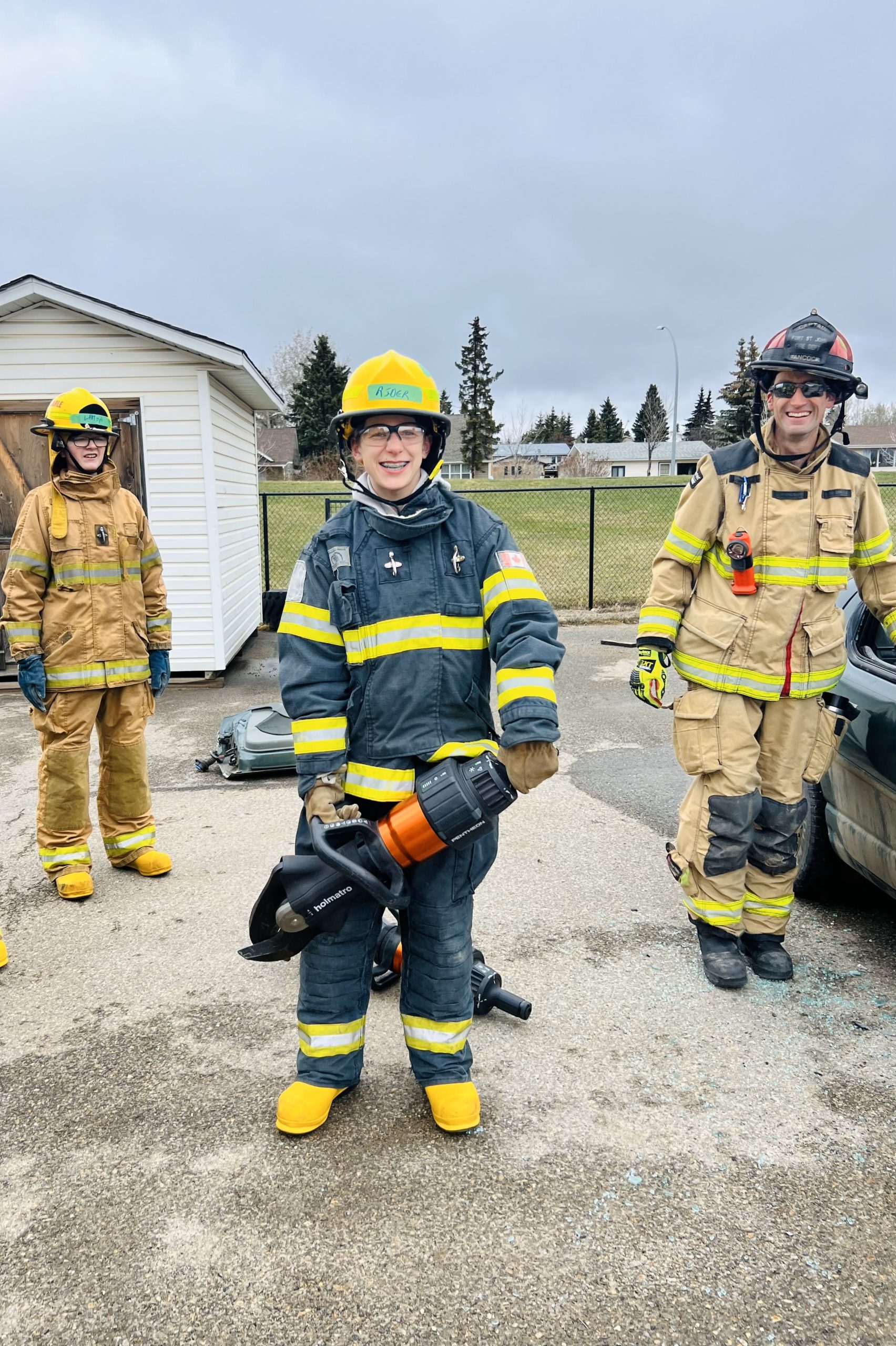 Fire Boot Camp students learning from professional firefighters.