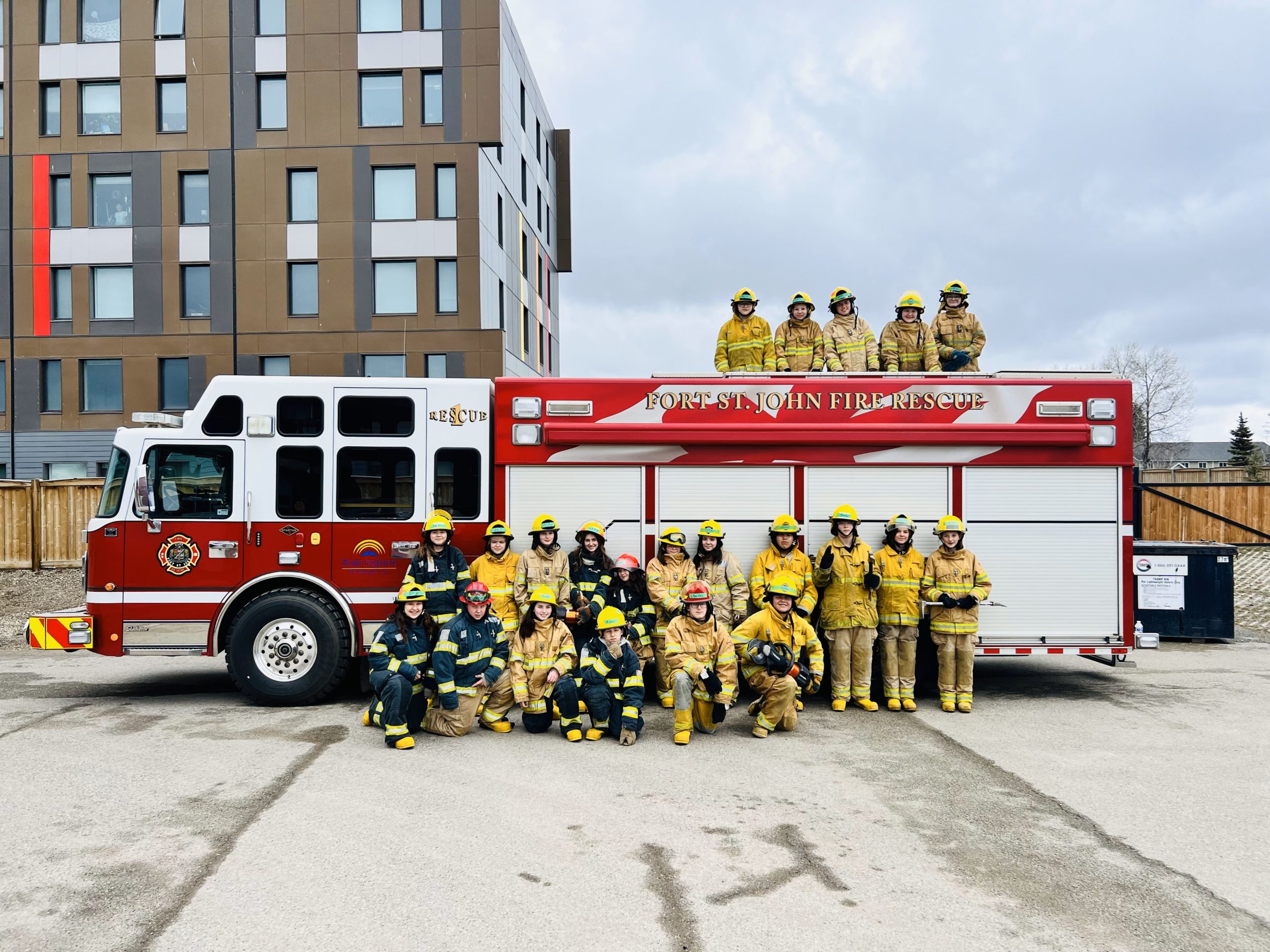 Fire Boot Camp students learning from professional firefighters.